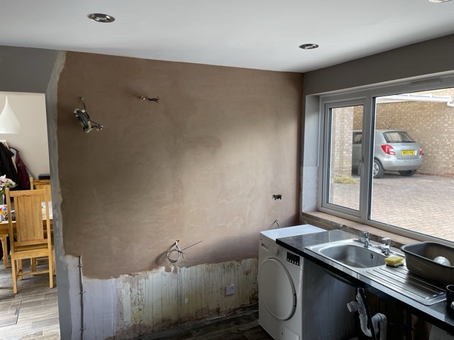 Smooth newly skimmed kitchen wall after renovation plastering in Redditch
